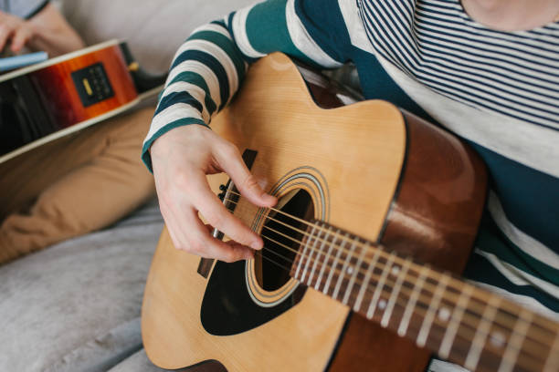 istock Learning to play the guitar. Music education 1014415282