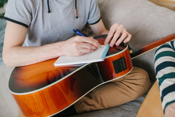 istock Learning to play the guitar. Music education 1014415394