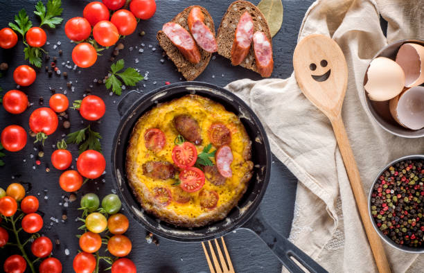 istock omelette from chicken eggs in a round black frying pan 1014418262