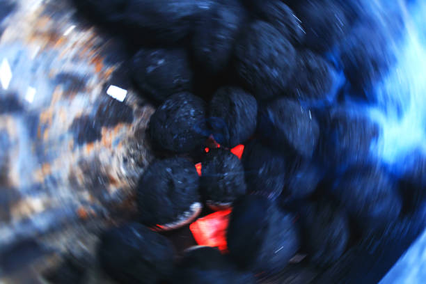 Best charcoal ember background with circular rotation effect. Conceptual picture for barbeque and high temperature.