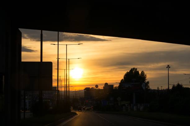 istock Sunset on the road with traffic. 1014426312