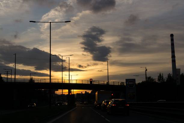 istock Sunset on the road with traffic. 1014426324