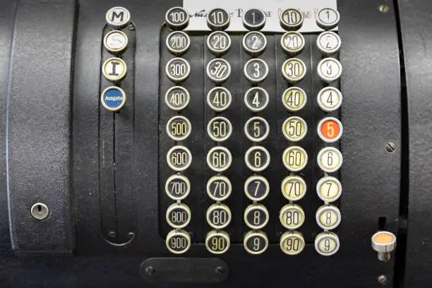 detail of old historic cash register with numbers