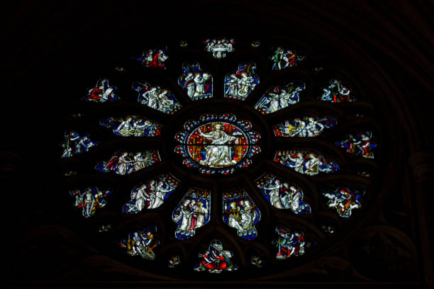 istock Inside Bristol Cathedral we can see the amazing stained glass windows with the representation of different Saints. An amazing view of the church interior viewing the Christianity life 1014447942
