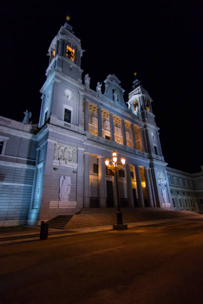 istock Madrid Almudena Cathedral, beside Royal Palace, during night time illuminated. A view during a winter Christmas day. Madrid, Spain 1014453686