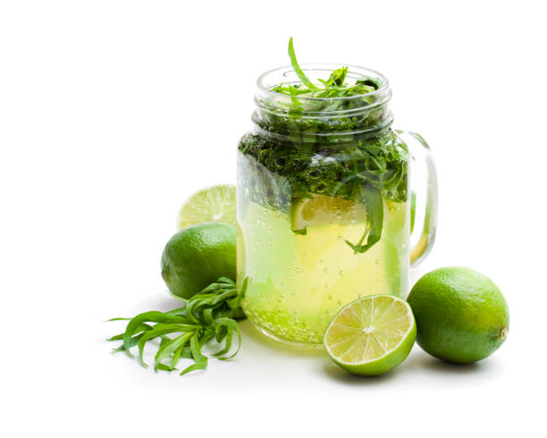istock Green  lemonade with tarragon and lime isolated on white 1014458432
