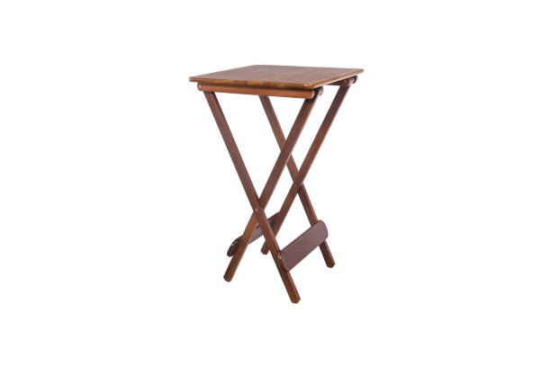 Outdoor wooden dining table with two stools on white background