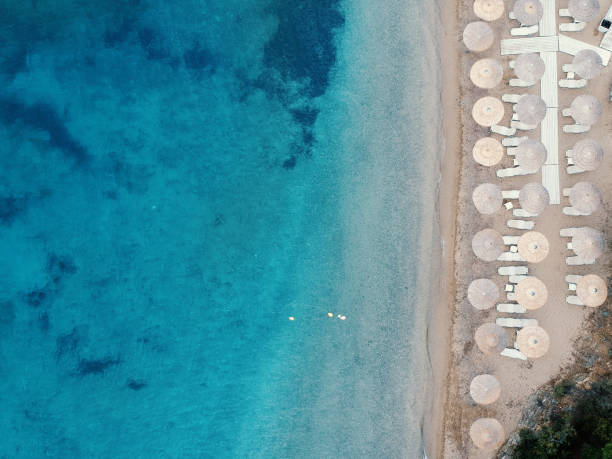 istock Beach with umbrellas and a bright water 1014459090