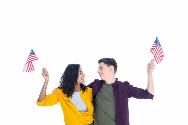 istock embracing teenage students with american flags isolated on white 1014462472
