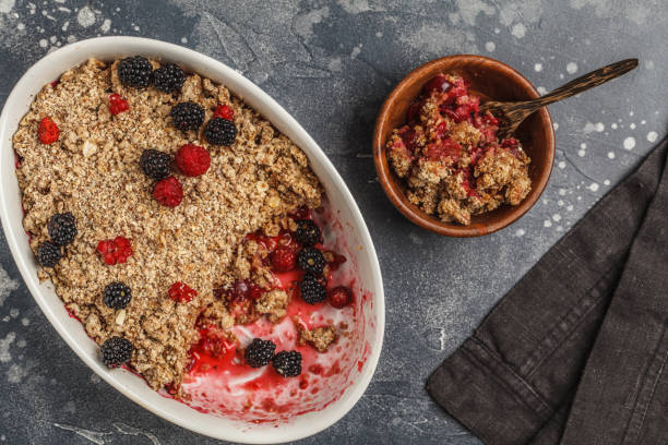 istock Breakfast with coffee and crumble pie, dark background, healthy vegan breakfast concept. 1014462664