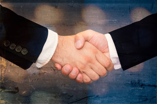 istock Partners shaking hands - business concept 1014462852