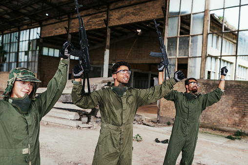 Popular warfare game with artificial - replica guns called airsoft, where players develop strategies and encourage teamwork.
