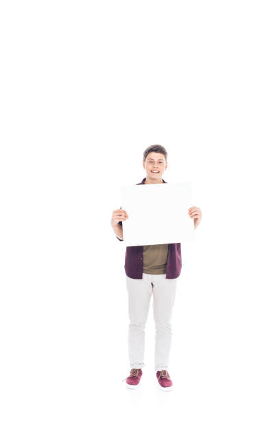 istock smiling teenager with empty banner in hands isolated on white 1014464924