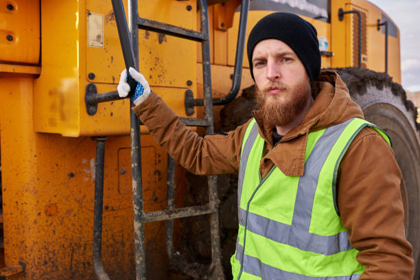 istock Bearded Gold Miner Posing with Truck 1014465910