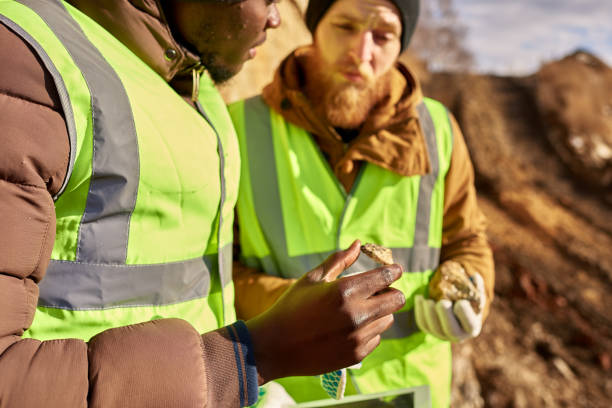 istock Miners Inspecting Land  for Minerals 1014465964
