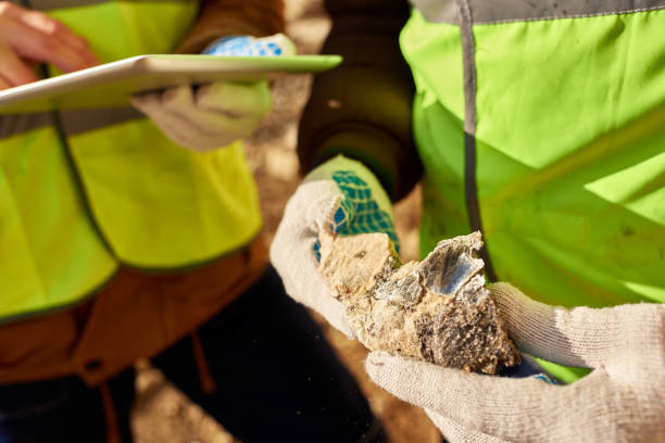 istock Unrecognizable Miner Holding Chunk of Mineral 1014466016