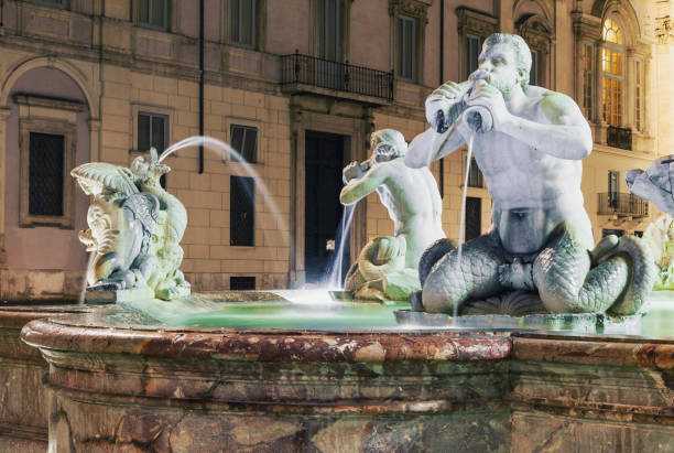 Fontana del Moro fountain in Piazza Navona in Rome at night Fontana del Moro fountain in Piazza Navona, Rome, Italy at night fontana del moro stock pictures, royalty-free photos & images