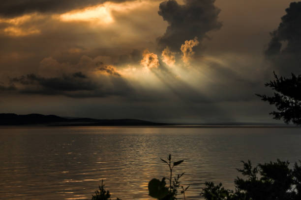 Vermont sunsets and sunrises over lakes including sunbursts, dramatic skies, inspirational cloud scenes, sky reflections, sailboats, kayakers and more