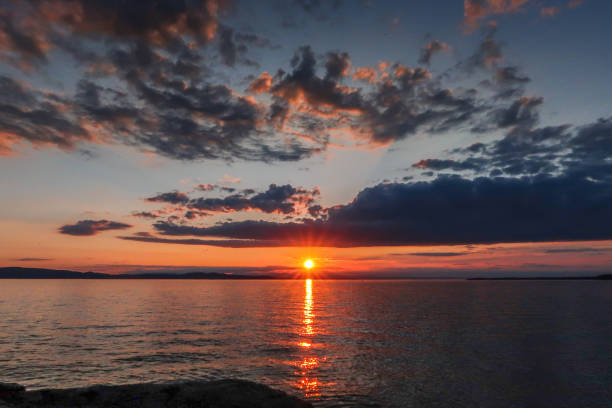 istock Vermont Sunsets and Sunrises over Water 1014471260