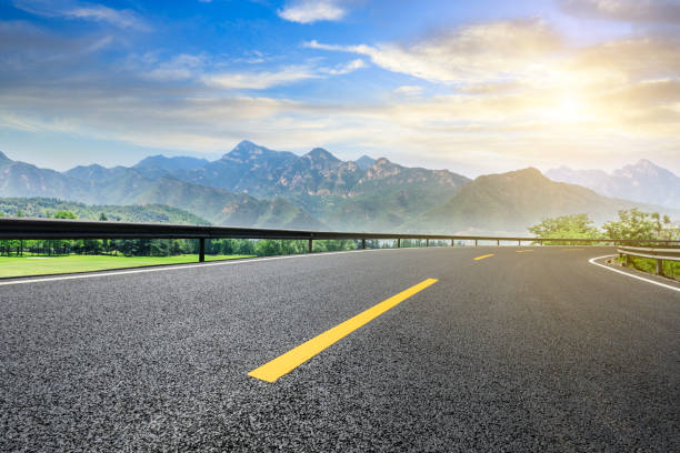 istock Asphalt highway and green mountain nature landscape 1014477510