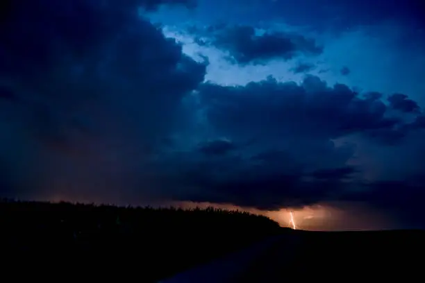 Thunderstorm with Lightning under Nightsky with Stars