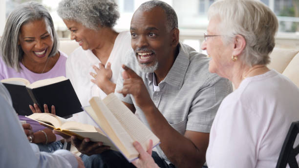 istock Senior man uses humor during outdoor Bible study 1014480166