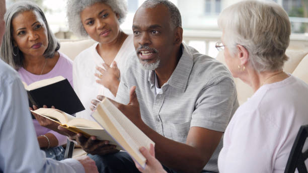 istock Senior man leads outdoor Bible study 1014480168