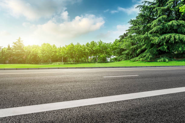 istock Asphalt road and green forest landscape under the blue sky 1014489078