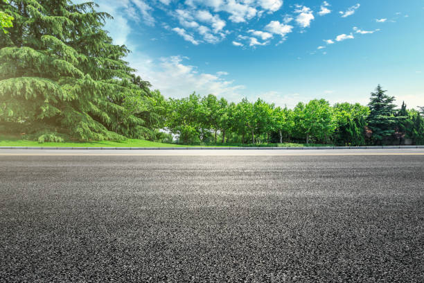 istock Asphalt road and green forest landscape under the blue sky 1014493530