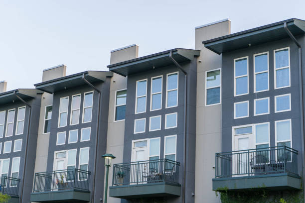 istock Blue And Gray Condominiums with Blue Sky Close Up 1014493746