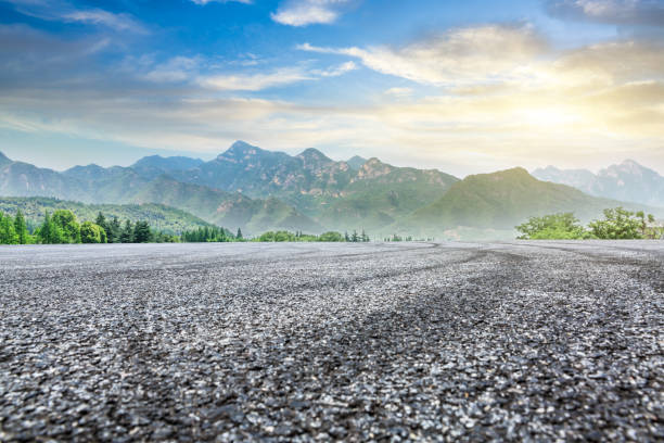 istock Car drift asphalt square and mountain with forest scene 1014499084