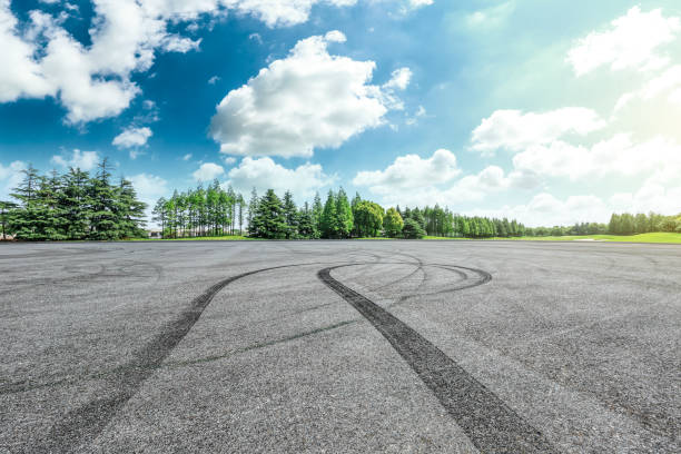 istock Car drift asphalt square and forest scene 1014499218