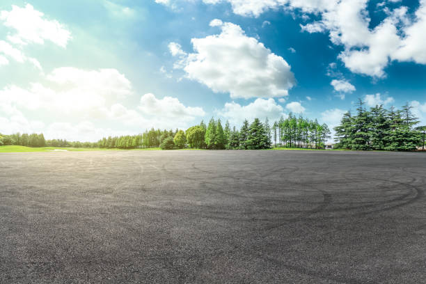 istock Car drift asphalt square and forest scene 1014499262