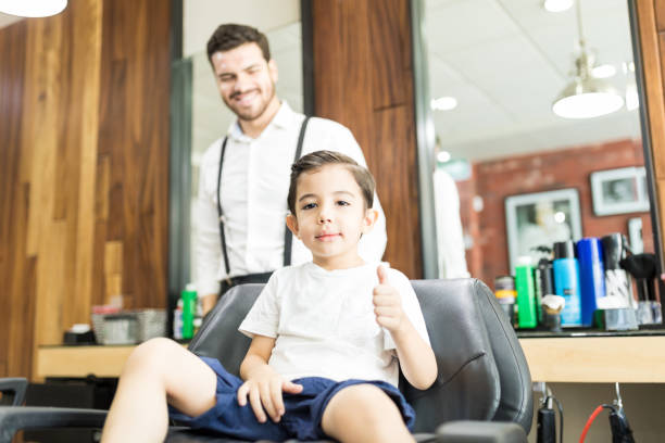 istock Cool Boy Showing Thumbs Up At Salon 1014504572