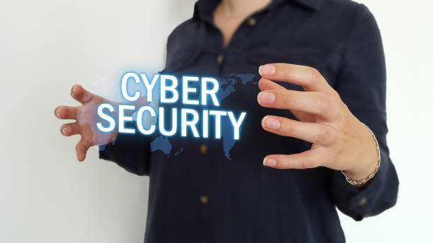 istock Businesswoman using cyber security text over a world map 1014509136