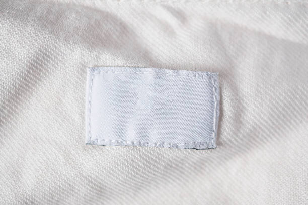 istock White blank laundry care clothes label on cotton shirt 1014519472