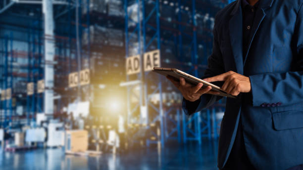 istock Businessman manager using tablet check and control for workers with Modern Trade warehouse logistics. Industry 4.0 concept 1014522340