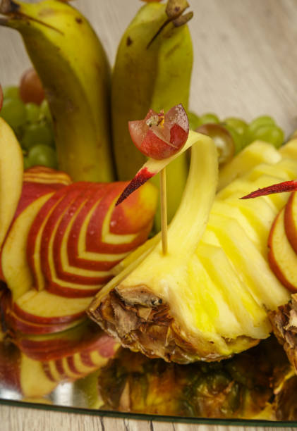 istock Very nice and artistically sliced fruits on a platter 1014529492