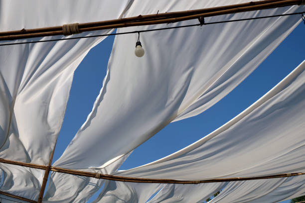 istock white white fabric texture wind blowing background, texture of flying fabric. 1014536968