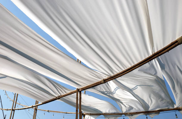 istock white white fabric texture wind blowing background, texture of flying fabric. 1014537022