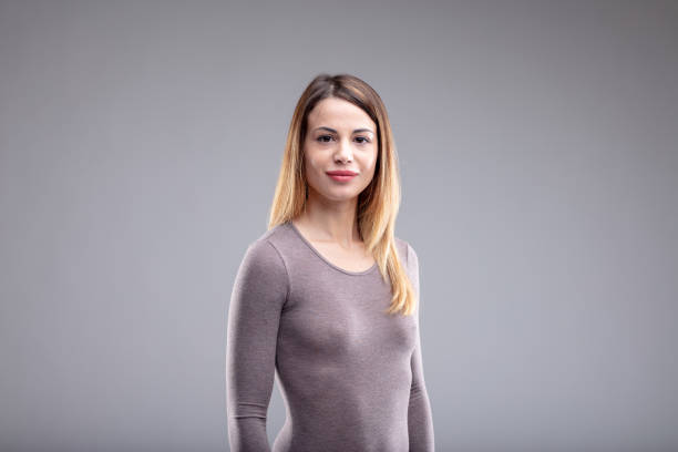 istock Happy woman standing turned away from camera 1014543948