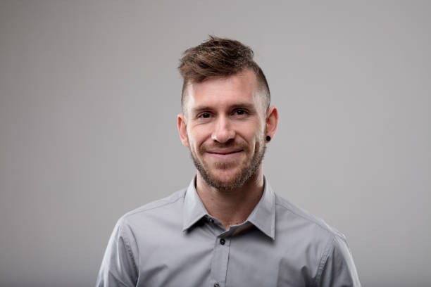 istock Smiling friendly man with modern haircut 1014543968