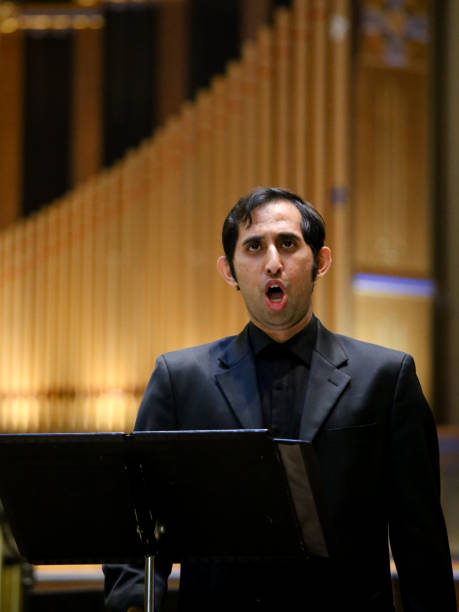 istock Indian Man Singing Opera, Large Organ Background 1014544122