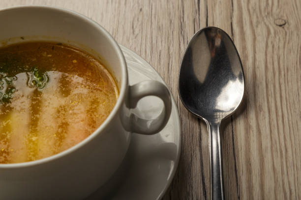 istock Plate with soup and cutlery on a wooden background 1014544424