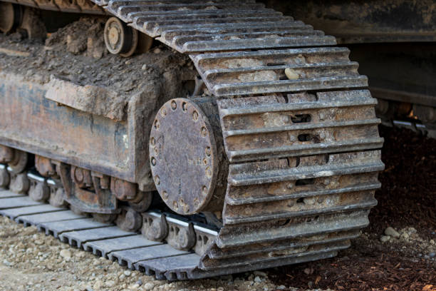 istock Industrial implement steel metal wheel tracks 1014547216