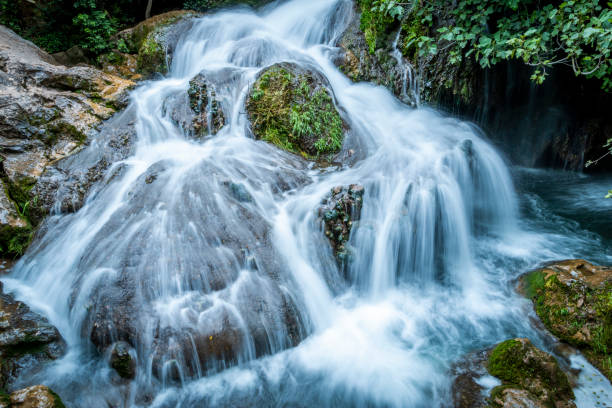 istock Big cascade flowing on mossy rock in the forest 1014549408