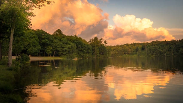 istock Trees framing Adirondack Mountains Haviland Cove Sunset Hudson River, Glens Falls, NY 1014549716