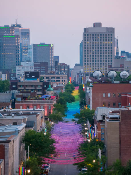 installazione di palline arcobaleno su saint-catherine street nel gay village, montreal, canada - catharine foto e immagini stock