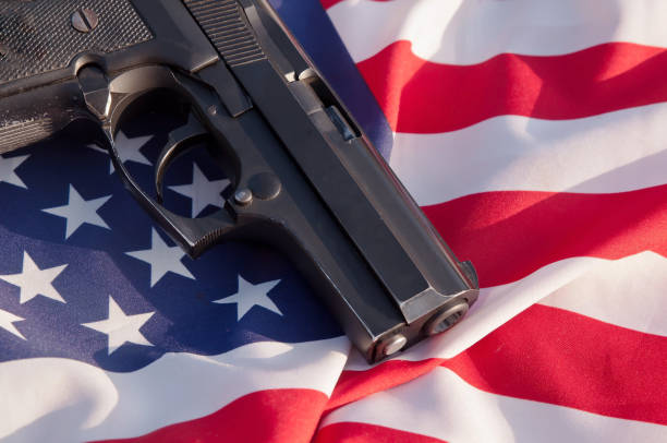 istock A pistol with an American flag background 1014566000