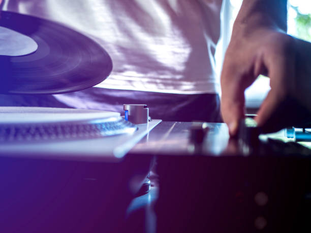 istock close up young dj playing modern music on professional equipment setup toned 1014576540